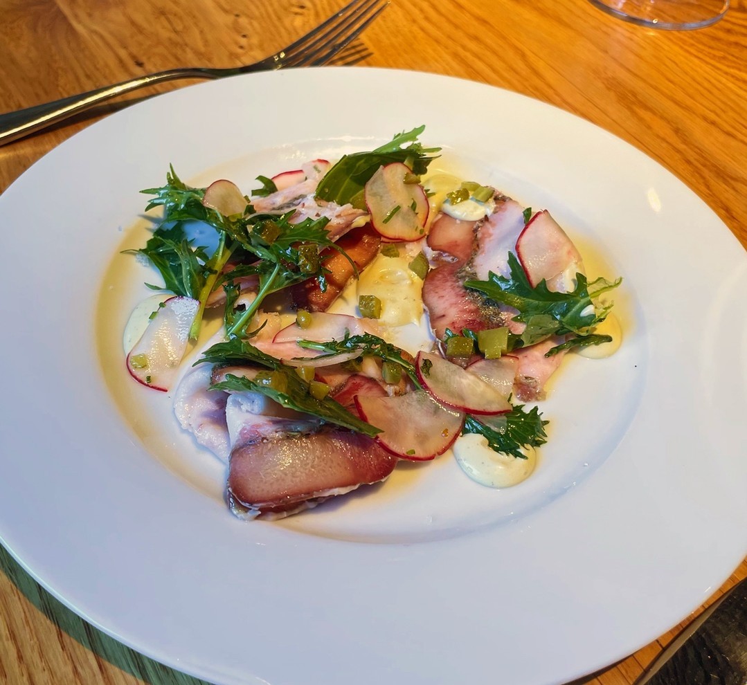 A new dish from the old world: Porchetta di Testa with tonnato, gherkins, radish, mizuna, and an herb lemon vinaigrette. This is a traditional Italian pork dish that is slow cooked for over 18 hours and served as a roulade. ⁠
.⁠
.⁠
.⁠
#oldworld #roulade #pork #porchetta #chseats #southofbroad #downtown