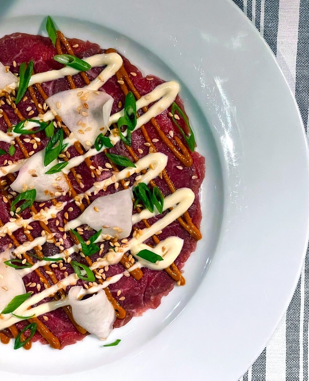 Our summer menu features cold plates for these incredibly hot days - like our Wagyu Beef Carpaccio. Served with sesame, salted turnips, scallion, kimchi vinaigrette, and aioli and paired with a cold cocktail of your choosing. ⁠
.⁠
.⁠
.⁠
#wagyu #carpaccio #eatlocal #southofbroad #explorecharleston #charleston #foodporn #chseats
