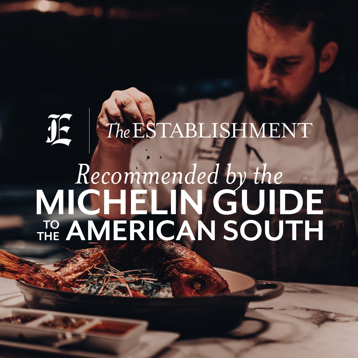 Executive Chef Elliott Howells preparing a whole fish, with text above image saying Recommended by the Michelin Guide to the American South