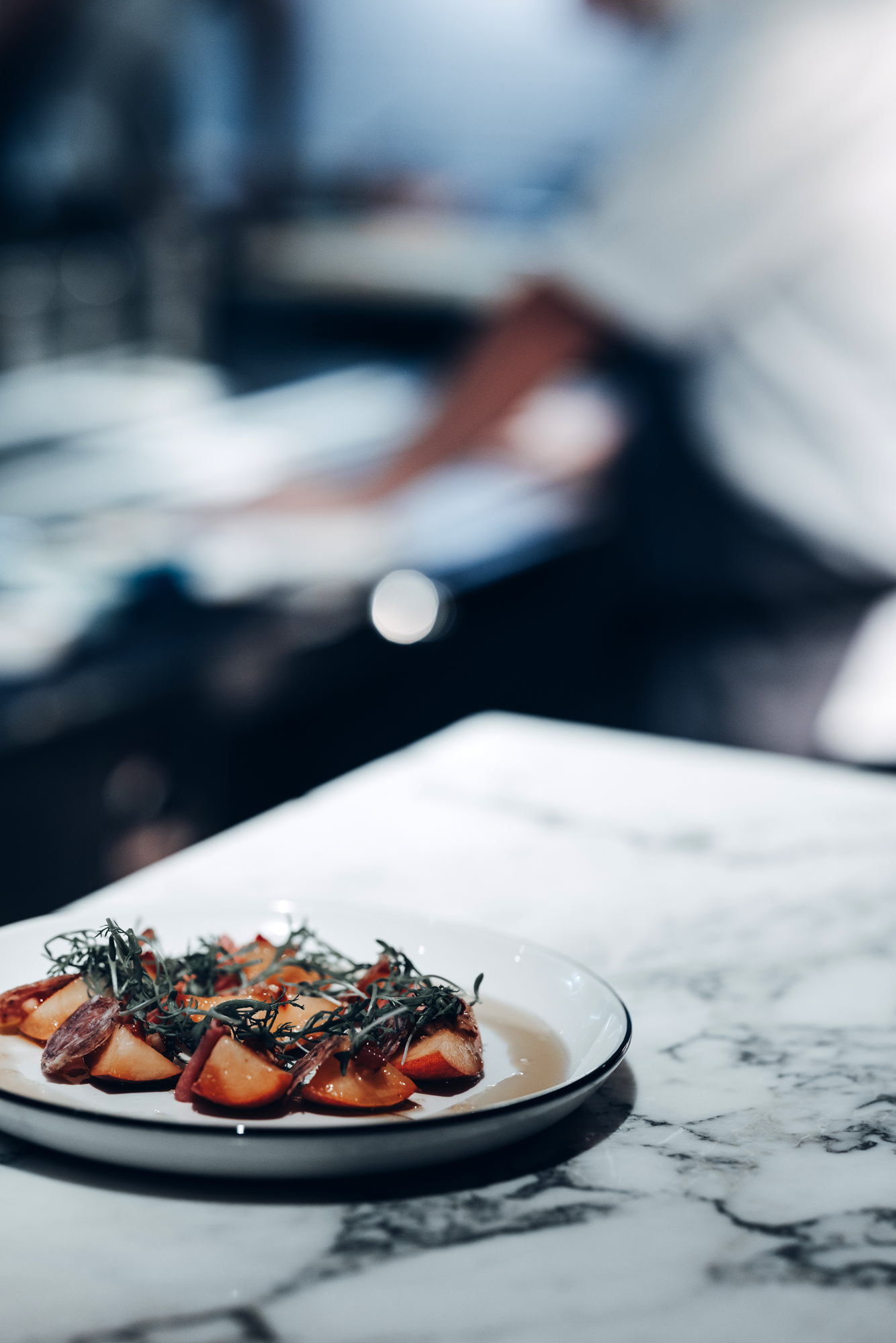 A beautifully composed course served at The Establishment's Chef's Counter